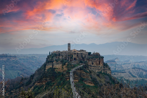 Civita di Bagnoreggio ancient medieval village in Italy. Tourists from all over the world come to see the dying city on the mountain. sunset and clouds. travel picturesque and powerful village concept