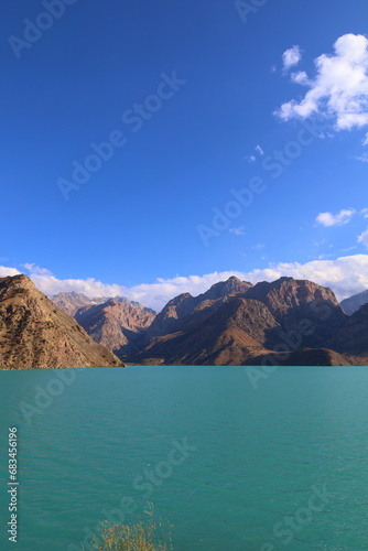 Turquoise mountain lake Iskandarkul located in Fann mountains, Sughd, Tajikistan