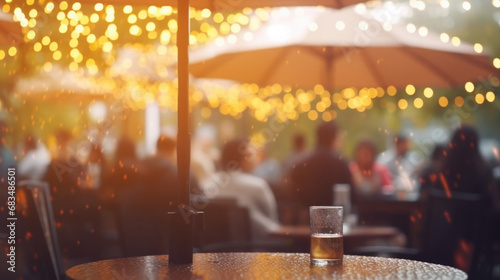 Closeup of a bustling outdoor cafe, with raindrops creating a blurred effect on the patio umbrellas and people huddled under them.