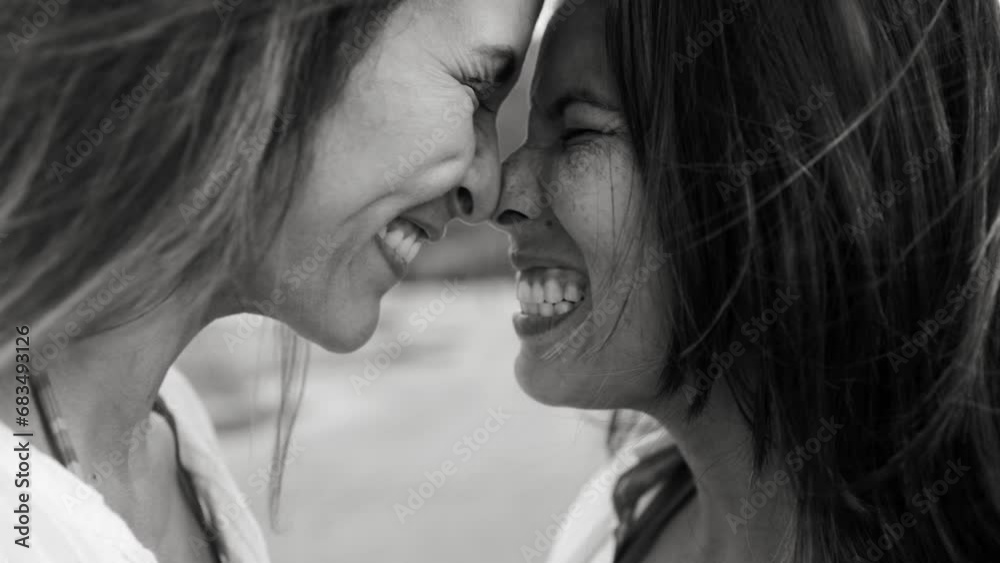 Gay lesbian couple enjoy together outside. LGBTQ relationships and valentine's concept. Black and white editing Gay lesbian couple enjoy together outside. LGBTQ relationships and valentine's concept. Black and white editing