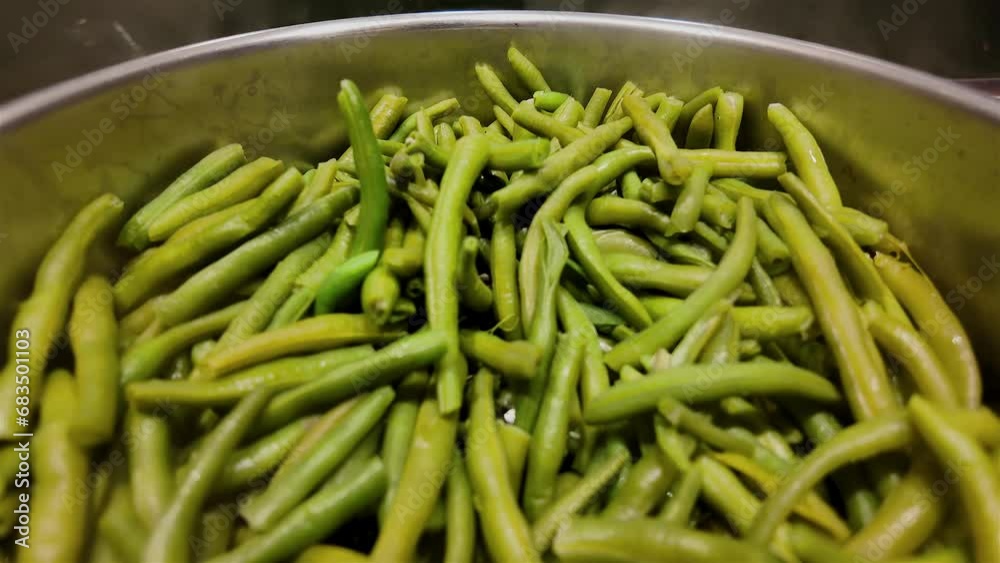Cooking fresh green beans in slow motion, haricots verts
