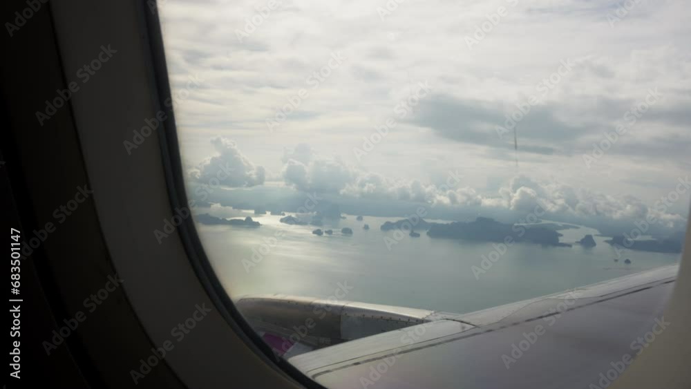 view from an airplane window showcases a patchwork of clouds against a boundless sky. The earth below appears miniature, a sense of awe and perspective. A stunning tableau of the aerial beauty. view from an airplane window showcases a patchwork of clouds against a boundless sky. The earth below appears miniature, a sense of awe and perspective. A stunning tableau of the aerial beauty.