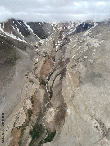 The Valley of Ten Thousand Smokes in Katmai National Park and Preserve in Alaska is filled with ash flow from Novarupta eruption in 1912. River eroding volcanic ash flow. Aerial view. photo