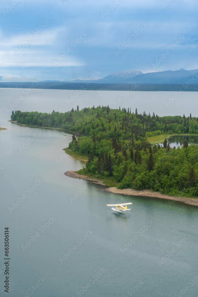 Port Alsworth, Alaska: Aerial view of de Havilland Canada DHC-2 Beaver floatplane taking off from Hardenburg Bay on Lake Clark in Lake Clark National Park. 