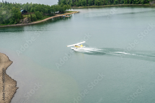 Port Alsworth, Alaska: Aerial view of de Havilland Canada DHC-2 Beaver floatplane taking off from Hardenburg Bay on Lake Clark in Lake Clark National Park.  photo