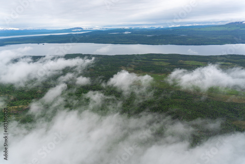 Aerial view of clouds and shore line of Six Mile Lake, between Lake Clark and Lake Iliamna in Alaska. Near Nondalton, Mud River, Newhalen River, Pickerel Lakes. photo