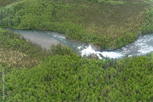 Lake Clark National Park in Alaska. Tanalian Falls and Tanalian Mountain and river. Aerial view of spruce trees  rugged mountains and popular day hike area near Port Alsworth.