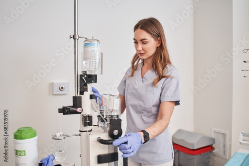 Female doctor preparing for MRI procedure in hospital