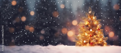 Christmas tree decorations with snow, blurred, sparking, glowing winter background