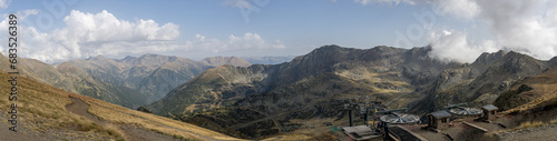 Panoramic of the Aracal?s mountains and the chairlift facilities from the pic de peyreguils on the border between Andorra and France photo