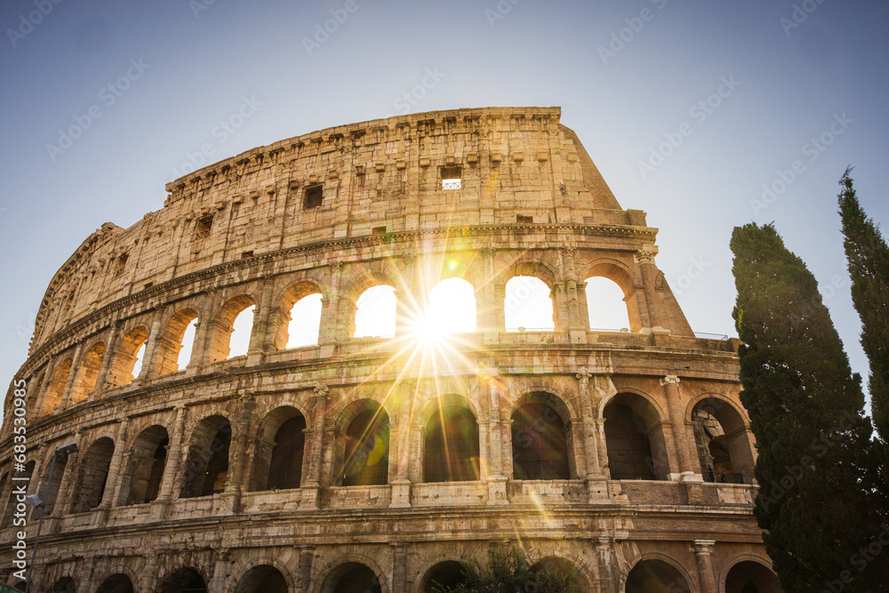 Colosseum with sunburst.