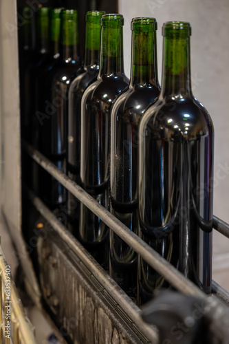 Wine making line, bottling and corking line in underground cellar, Saint-Emilion wine making region picking, cru class Merlot or Cabernet Sauvignon red wine grapes, France, Bordeaux