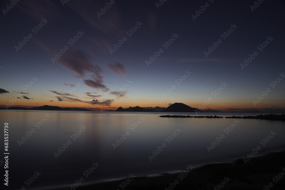 Fototapeta premium sunset on the beach. Seaside town of Turgutreis and spectacular sunsets. Selective Focus. Long Exposure shoot. tranquility scene.