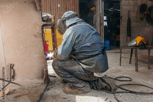 welder in quarry working with welding