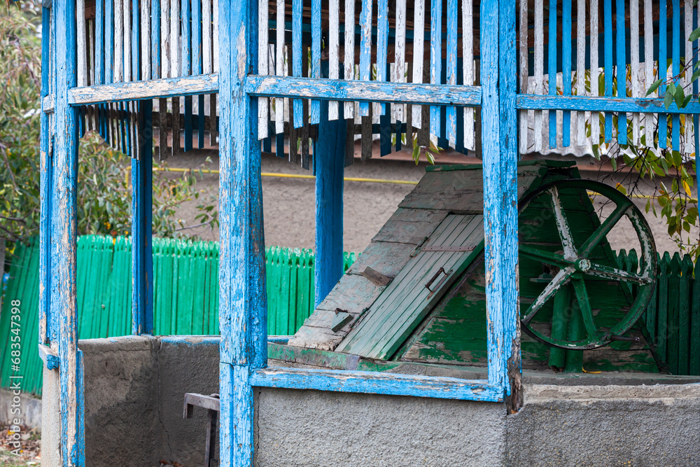 Authentic Moldovan village well. Old wooden ornament to protect the water source from dirt and debris.