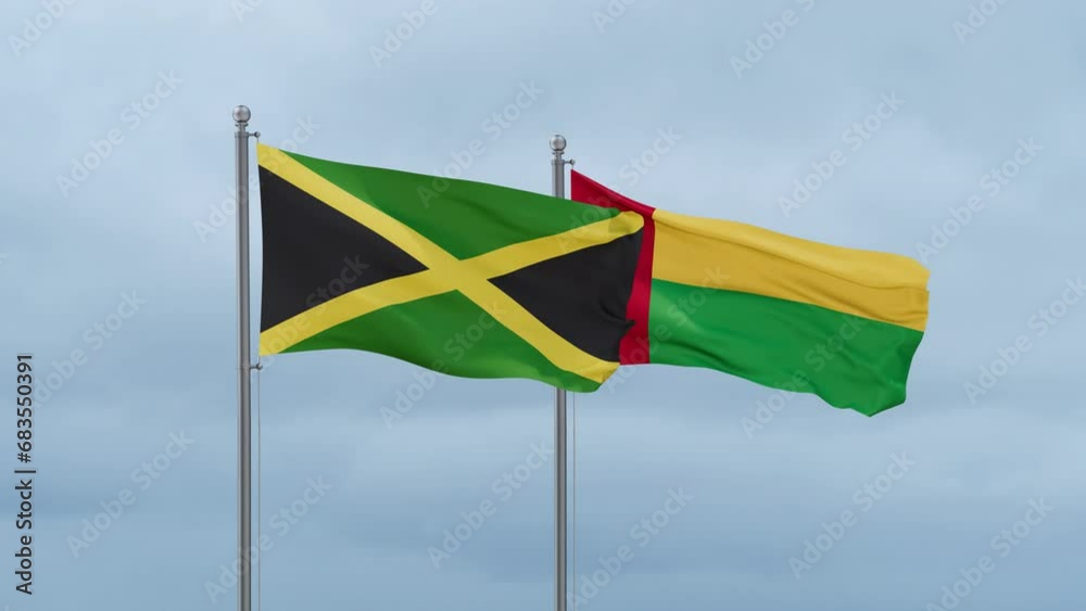 Guinea-Bissau flag and Jamaica flag waving together on cloudy sky, endless seamless loop, two country relations concept Guinea-Bissau flag and Jamaica flag waving together on cloudy sky, endless seamless loop, two country relations concept