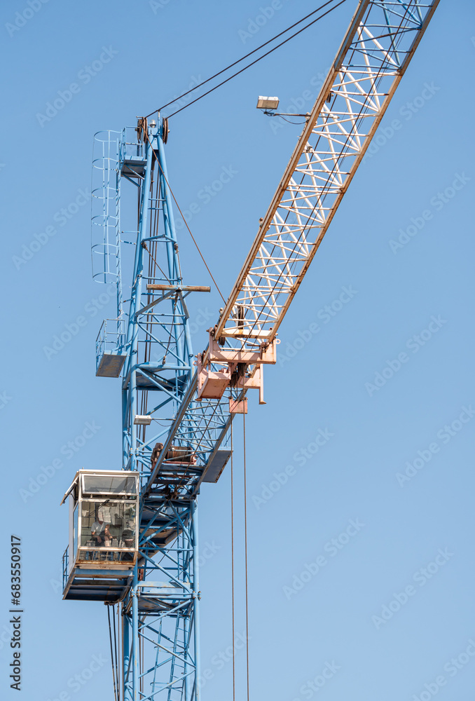 Construction tower crane for lifting loads to a height.