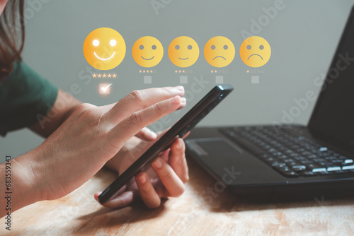 Customer review satisfaction feedback survey concept. Client give 5-star rate service experience on online application. Customers can evaluate quality of service leading to business reputation rating.
