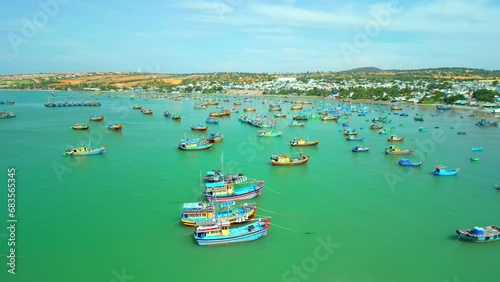 Hundreds of boats are anchored in the sea on a sunny day. This is a bay for boats avoiding storms during the rainy season. 4K photo