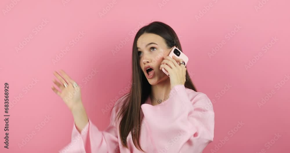 Close up of annoyed irritated young woman with an angry face have call talk looking furious, mad and feeling frustrated isolated on pink background. Brunette girl expressions and emotions. Oh no. Close up of annoyed irritated young woman with an angry face have call talk looking furious, mad and feeling frustrated isolated on pink background. Brunette girl expressions and emotions. Oh no.