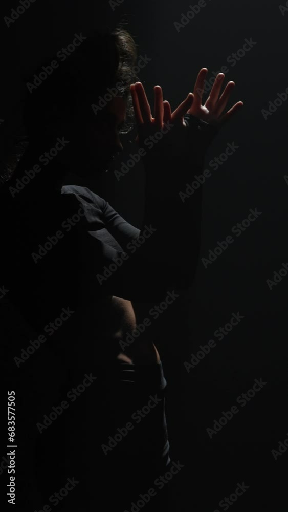 A graceful dancer presents a contemporary and stunning performance on stage. A graceful dancer presents a contemporary and stunning performance on stage.