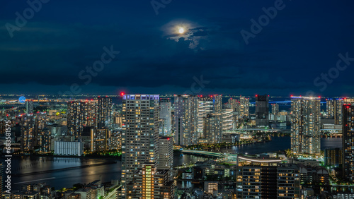 Tokyo skyline at night with moon