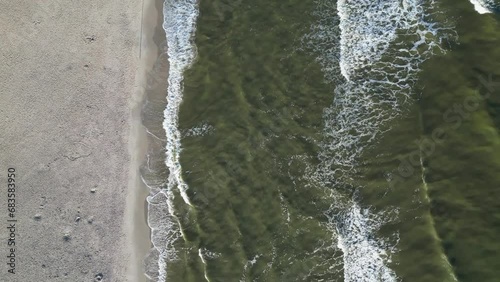 Only in the early hours can you see the emerald hue of the sea on the golden beach