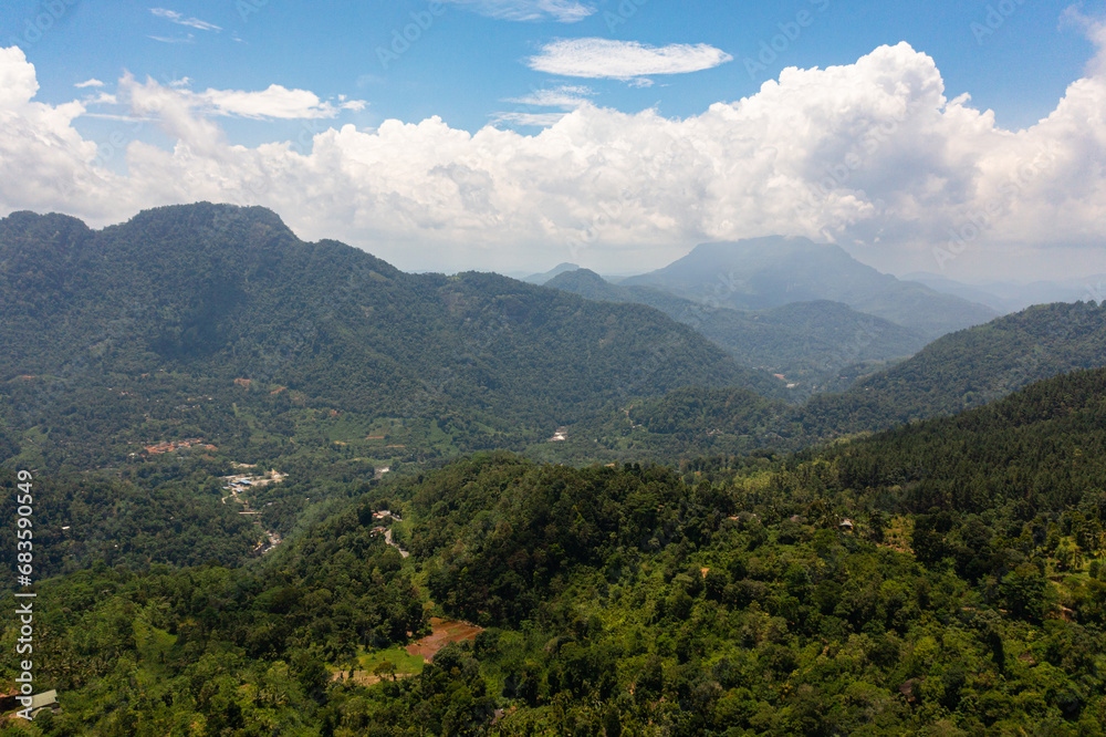 Aerial drone of Mountains with rainforest and jungle in the mountainous province of Sri Lanka.