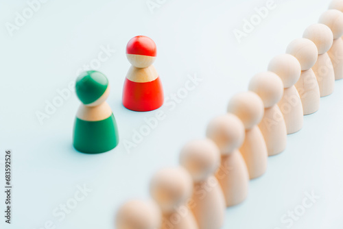 Red and green wooden figures teams against opponent or enemy. Strategy, Conflict, management, business planning, tactic, politic, communication and leader concept