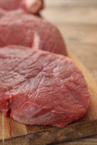 Pieces of raw beef meat on table, closeup