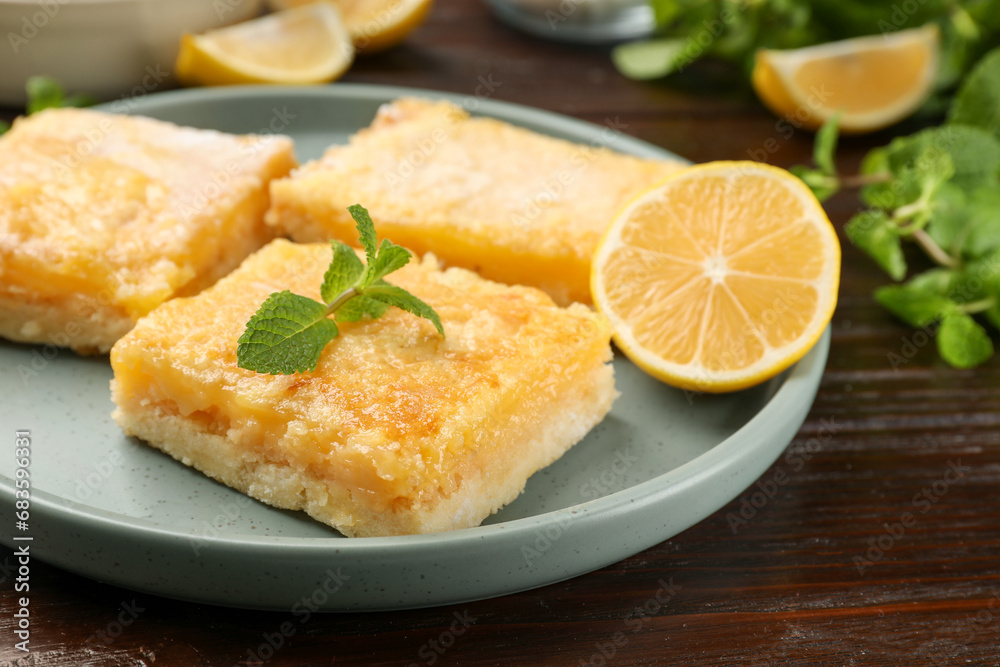 Tasty lemon bars served on wooden table, closeup Tasty lemon bars served on wooden table, closeup