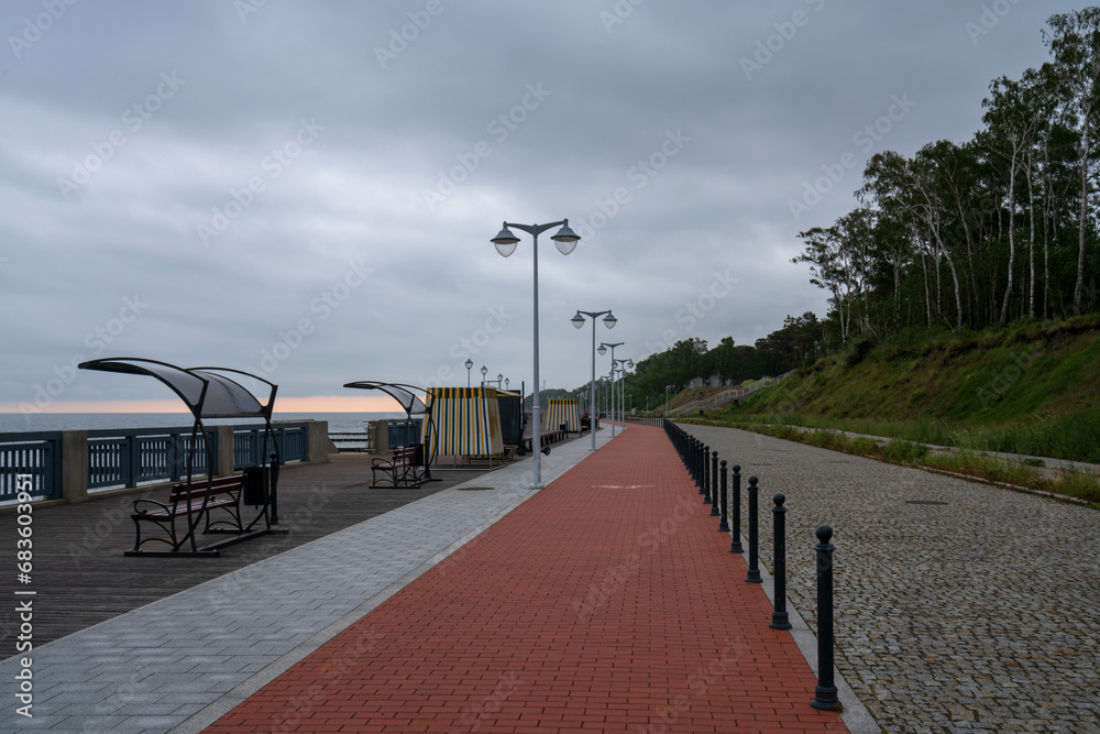 View of the promenade along the Baltic Sea coast and the city beach on a summer day, Svetlogorsk, Kaliningrad region, Russia