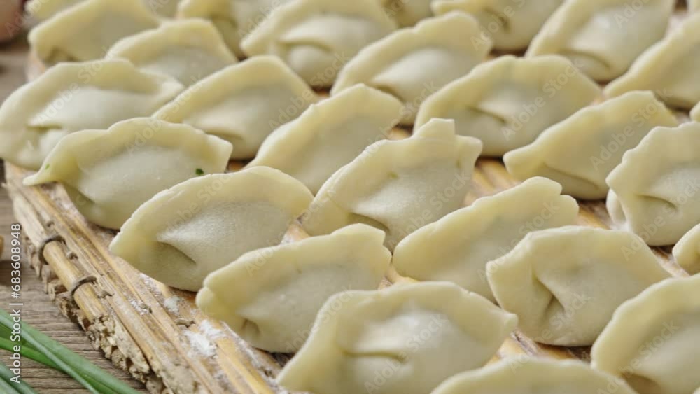 making dumplings in the kitchen. traditional food raw dimplings making dumplings in the kitchen. traditional food raw dimplings