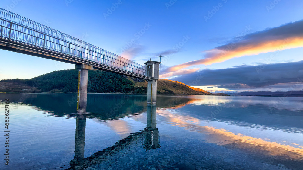 Fototapeta premium Amazing vibrant sunrise colours over Lake Tekapo