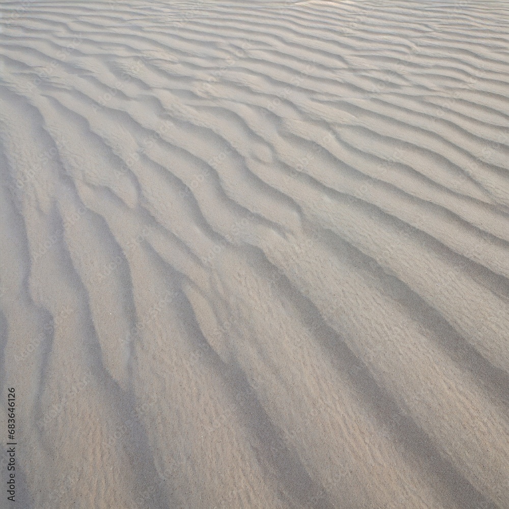 Sand texture dunes desert pattern waves background close up beach tide ripples Sand texture dunes desert pattern waves background close up beach tide ripples