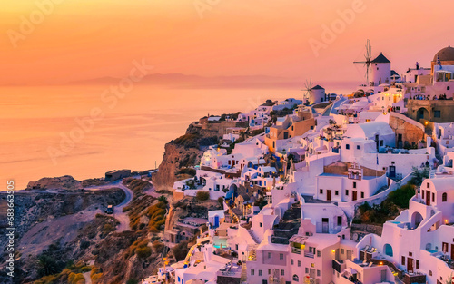 Sunset at the village of Oia Santorini Greece during summer with whitewashed homes and churches, Greek Island Aegean Cyclades Islands