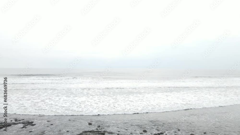 The foggy ocean view from a drone. The drone view panning from left to right The foggy ocean view from a drone. The drone view panning from left to right