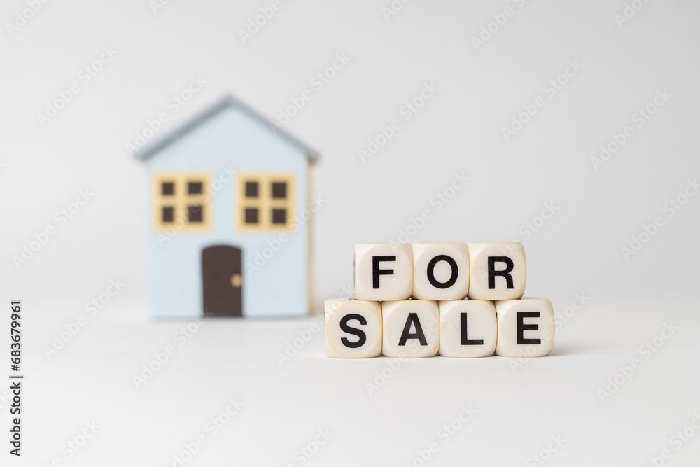 Classic house model on sale on white background, For sale written with dice and key