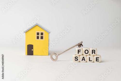 Classic house model on sale on white background, For sale written with dice and key