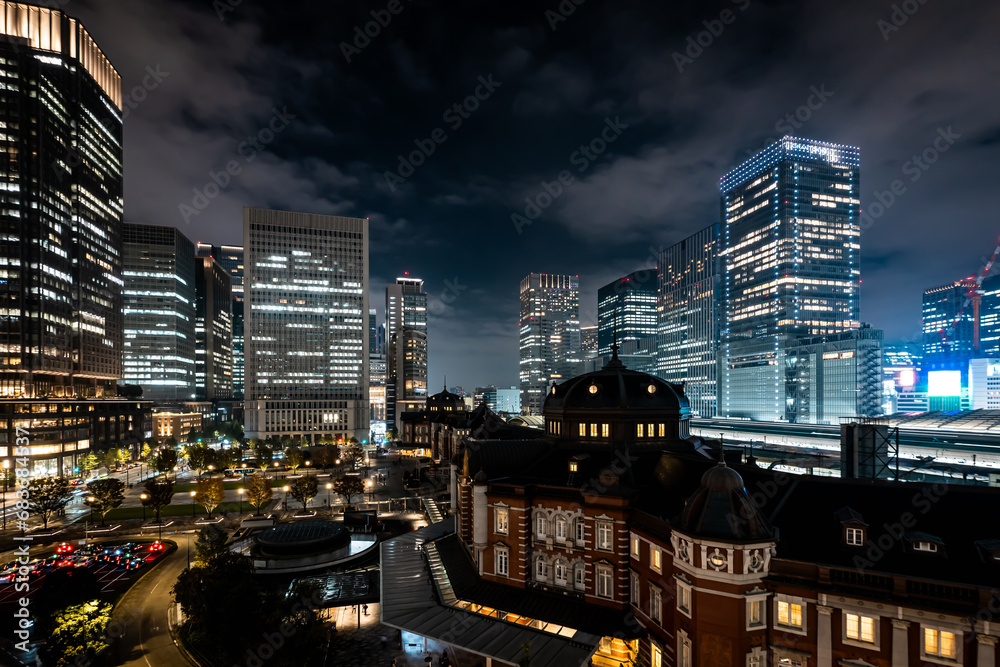 downtown illuminated by building lights downtown illuminated by building lights