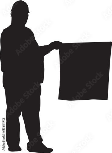 旗を持つ交通誘導警備員のシルエット