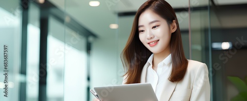 Busy young Korea business woman executive holding pad computer at work. East Asian female professional employee using digital tablet fintech device standing in office checking data. generative AI