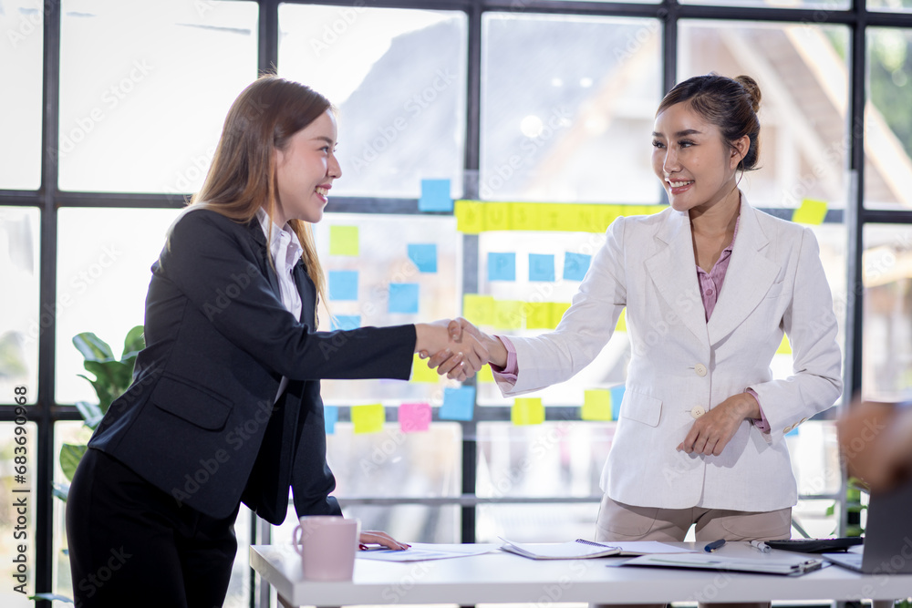 Fototapeta premium Business woman offer and give hand for handshake in office. Successful job interview. Apply for loan in bank. Salesman, bank worker or lawyer shake for deal, agreement or sale. Increase of salary.