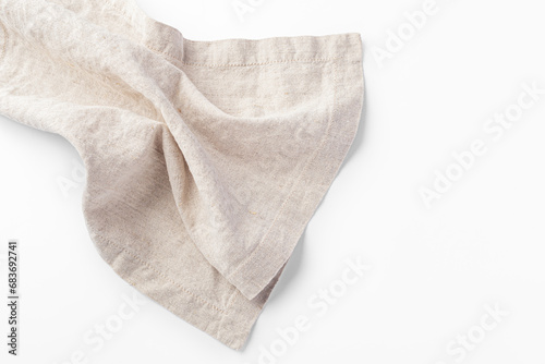 Natural linen kitchen cloth on white background, closeup photo