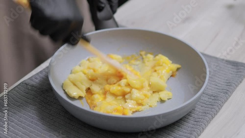 Time-lapse of baker mixing flour, butter, sugar and egg for making choux cream dough