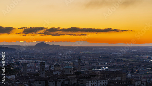 Bergamo, Italy. One of the beautiful city in Italy. Morning landscape at the old town from Saint Vigilio hill during fall season. Orange and red contest © Matteo Ceruti