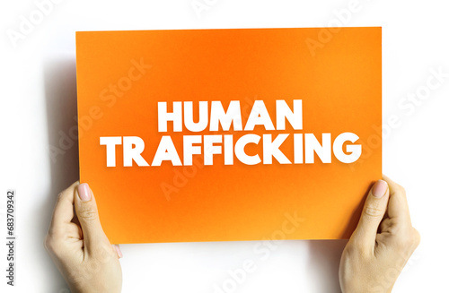Human Trafficking is the trade of humans for the purpose of forced labour, text concept on card for presentations and reports