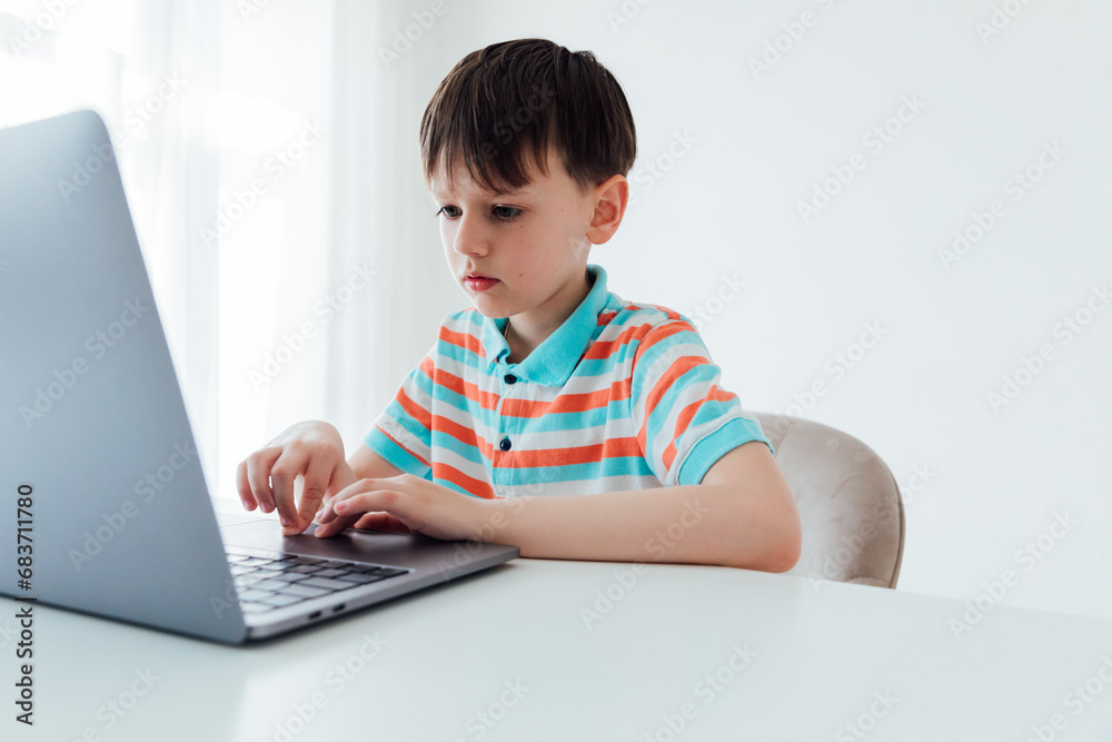 Boy with laptop online learning internet job Boy with laptop online learning internet job