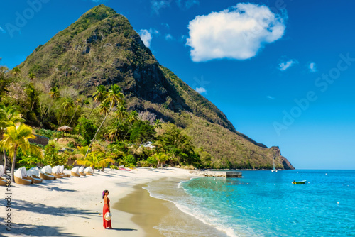 St Lucia Caribbean, woman on vacation at the tropical Island of Saint Lucia Caribbean ocean, Asian women in a red dress on the beach