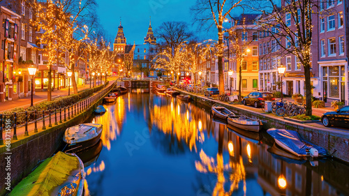 Amsterdam Netherlands canals with Christmas lights during December, canal historical center of Amsterdam at night in Europe